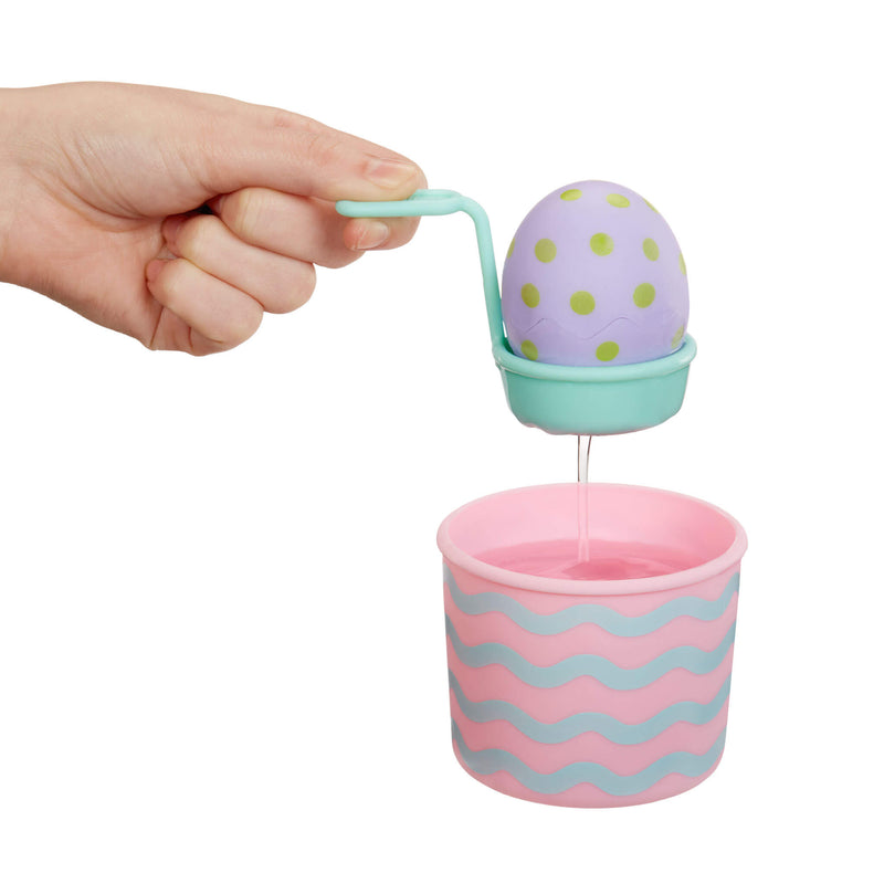 Dipping play egg into water