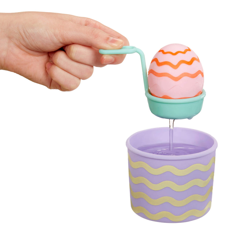 Dipping play egg into water