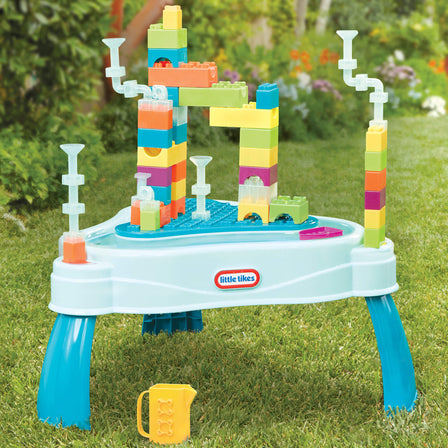 Build & Splash™ Water Table with 50+ Accessories - 
Enjoy this 50+ piece count of colorful blocks, pipes, boats, and a pitcher.