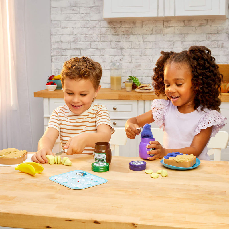 Girl and boy making a Peanut Butter & Jelly sandwich