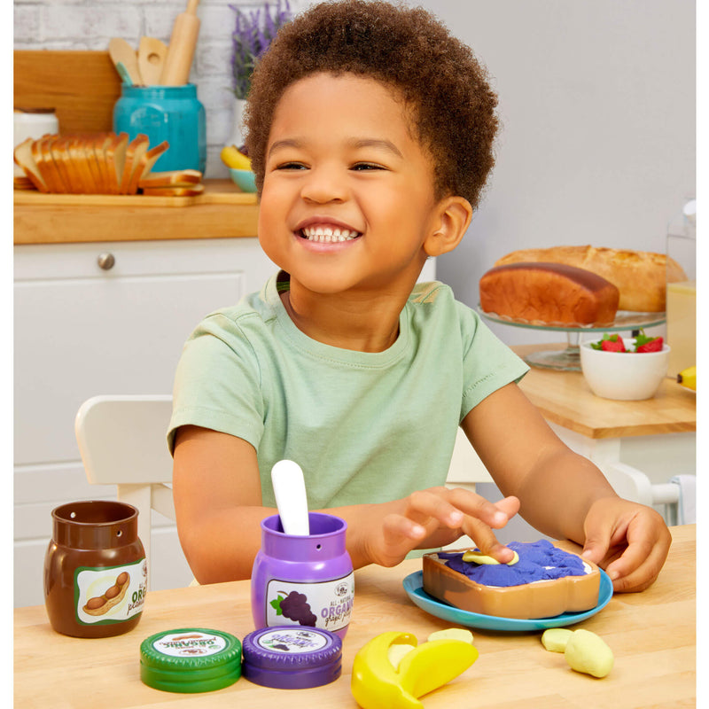 boy putting banana on jelly