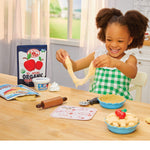 girl playing with the pie dough sand