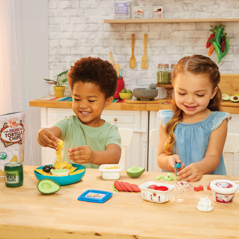 boy and girl preparing nachos