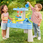 Toddler girl and boy playing with water table