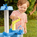 Boy using toy crane