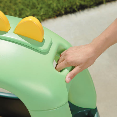 Cozy Coupe® - Dino - 
Handle on back for parent-controlled push rides.