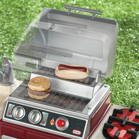 Backyard Barbecue™ Get Out 'n' Grill - 
Dual-level grill with an easy open and close lid.