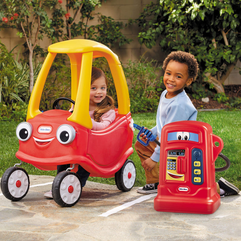 Boy using Pumper with Cozy coupe