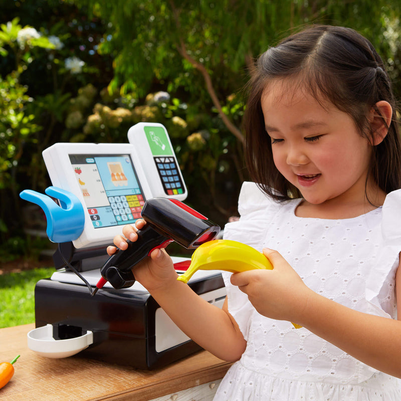 Girl using the toy scanner