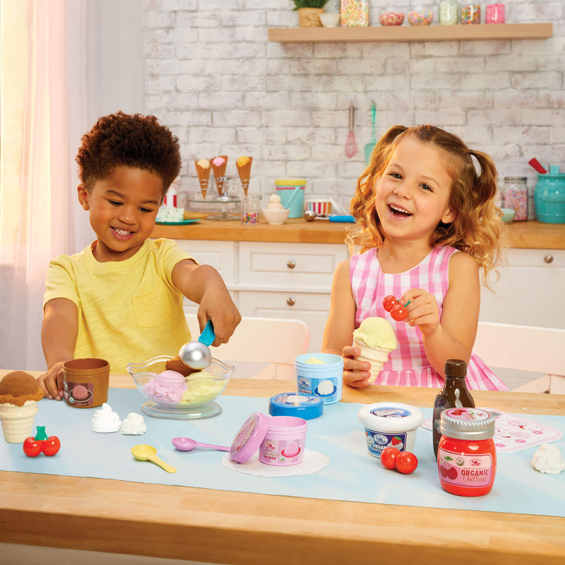 boy and girl making a sundae