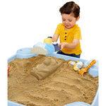 Boy using Bluey sand mold