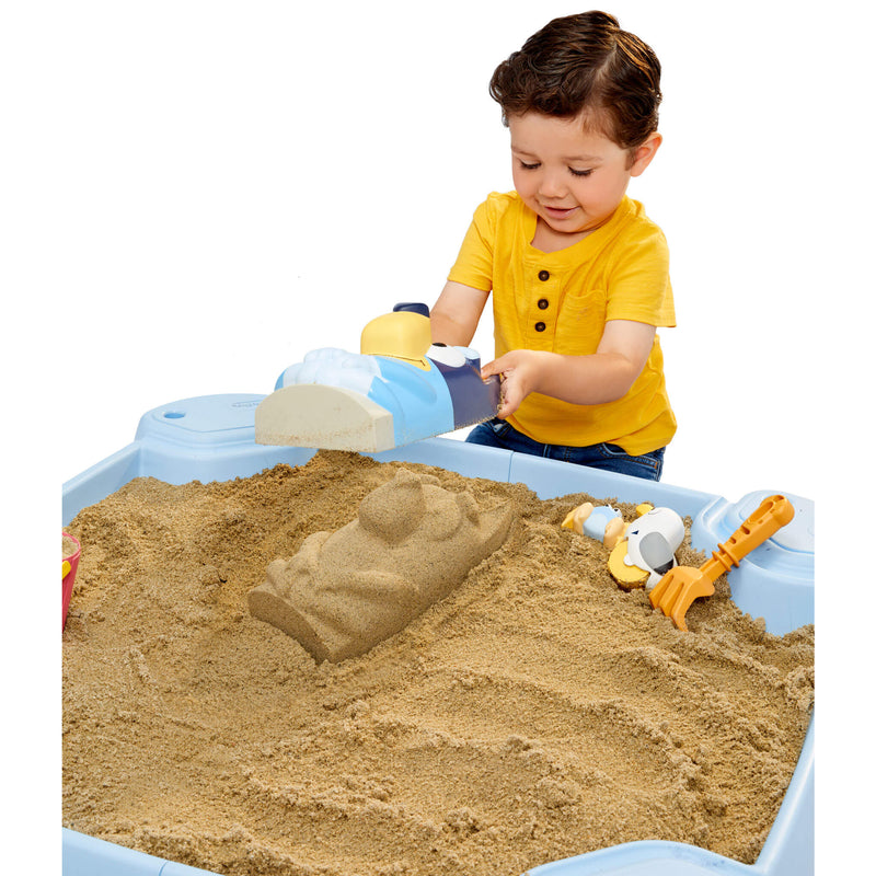 Boy using Bluey sand mold