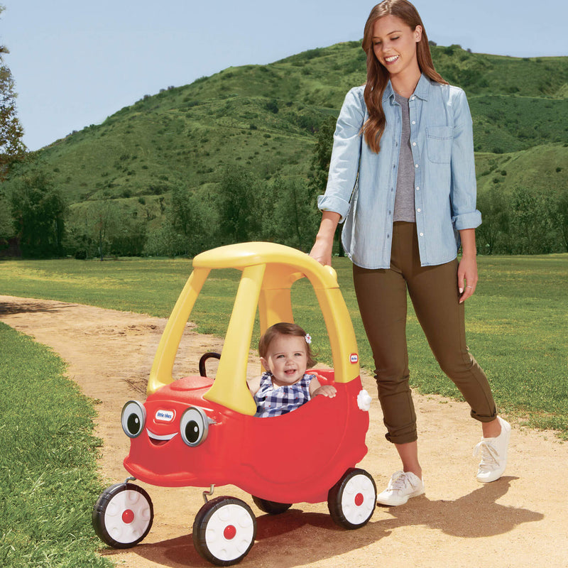 Parent pushing coupe