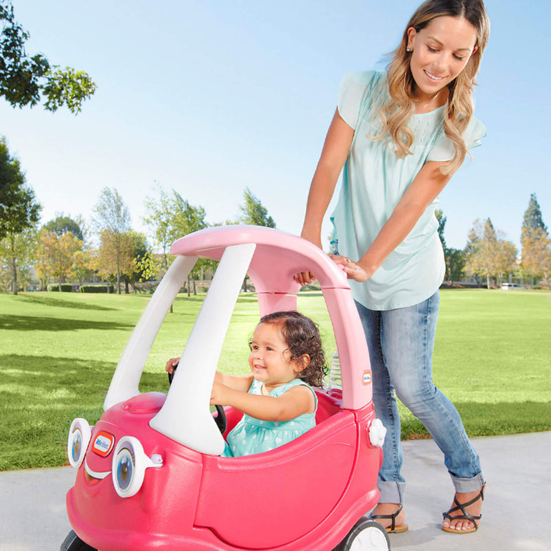 Parent pushing coupe