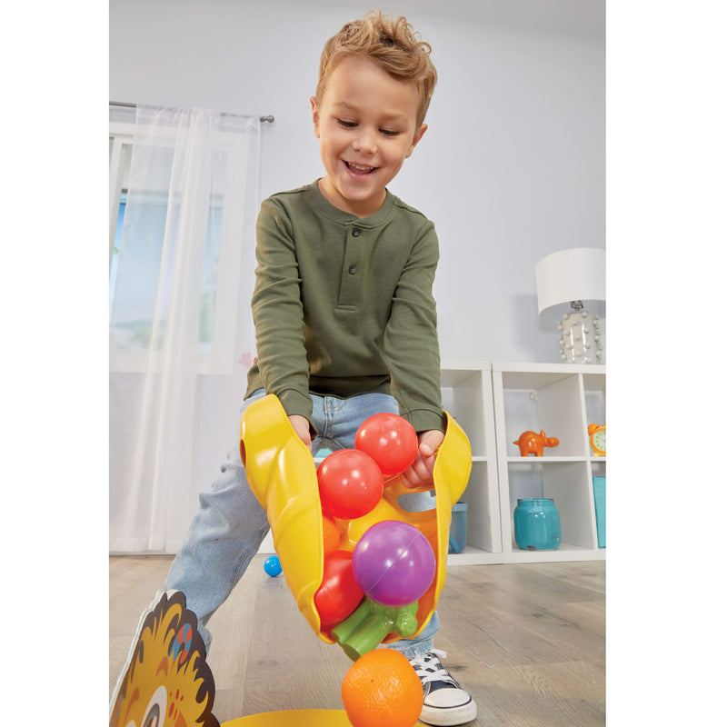 Child picking up balls to show how to play game