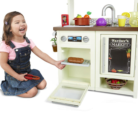 First Market Kitchen™ - 
Kids can pretend to bake their food in the interactive oven with a working door and clicking knobs.