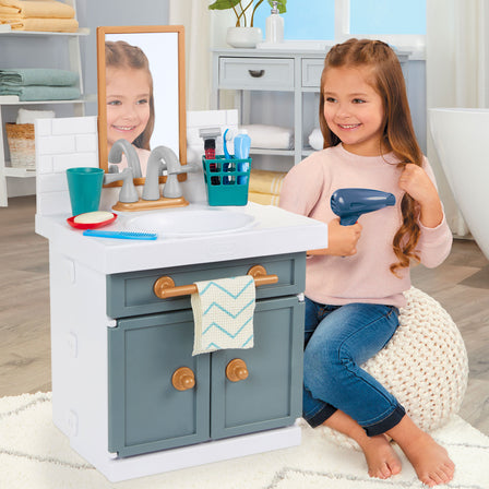 First Bathroom Sink - 
The hair dryer really blows air for true make-believe, hair styling.