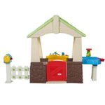 Playhouse has some neat extras like a sand and water table and a workbench with tools!