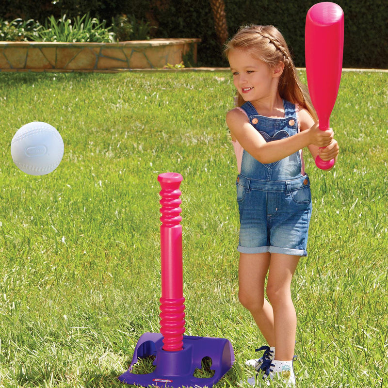 Girl hitting ball off the tee