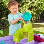 Pour water with the bucket to create a waterfall